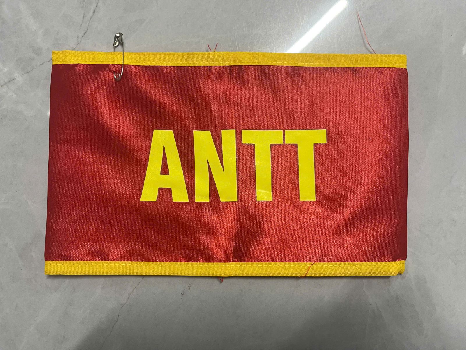 Băng Đeo Tay ANTT (Băng Đeo Tay An Ninh Trật Tự Màu Đỏ Viền Vàng)